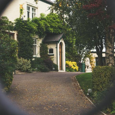 house viewed through garden gate